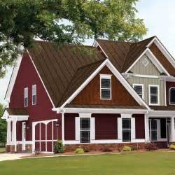 red house with brown metal roof|red galvanized metal roof.